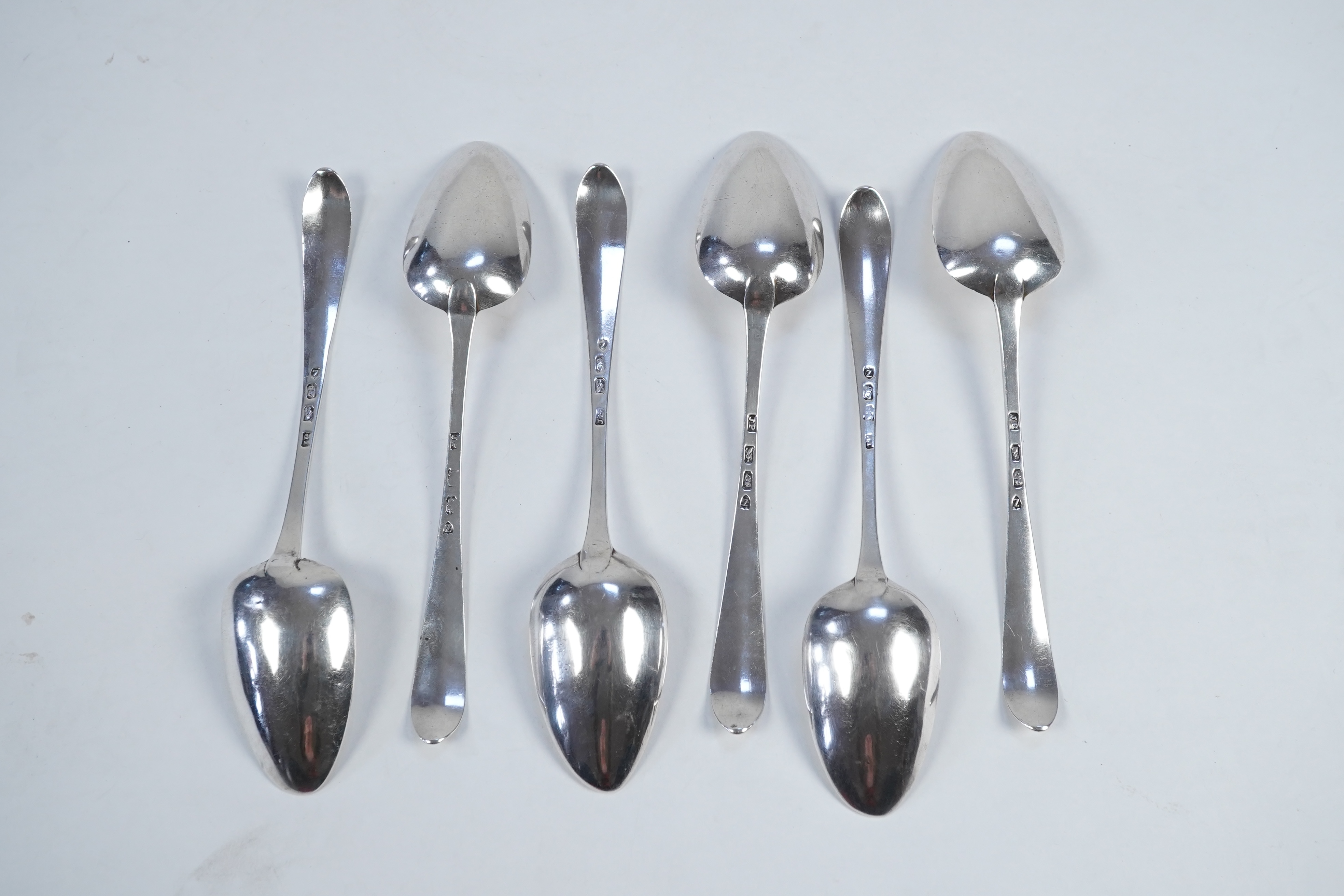 A set of six George III Irish silver bright cut engraved serving/table spoons by John Pittar